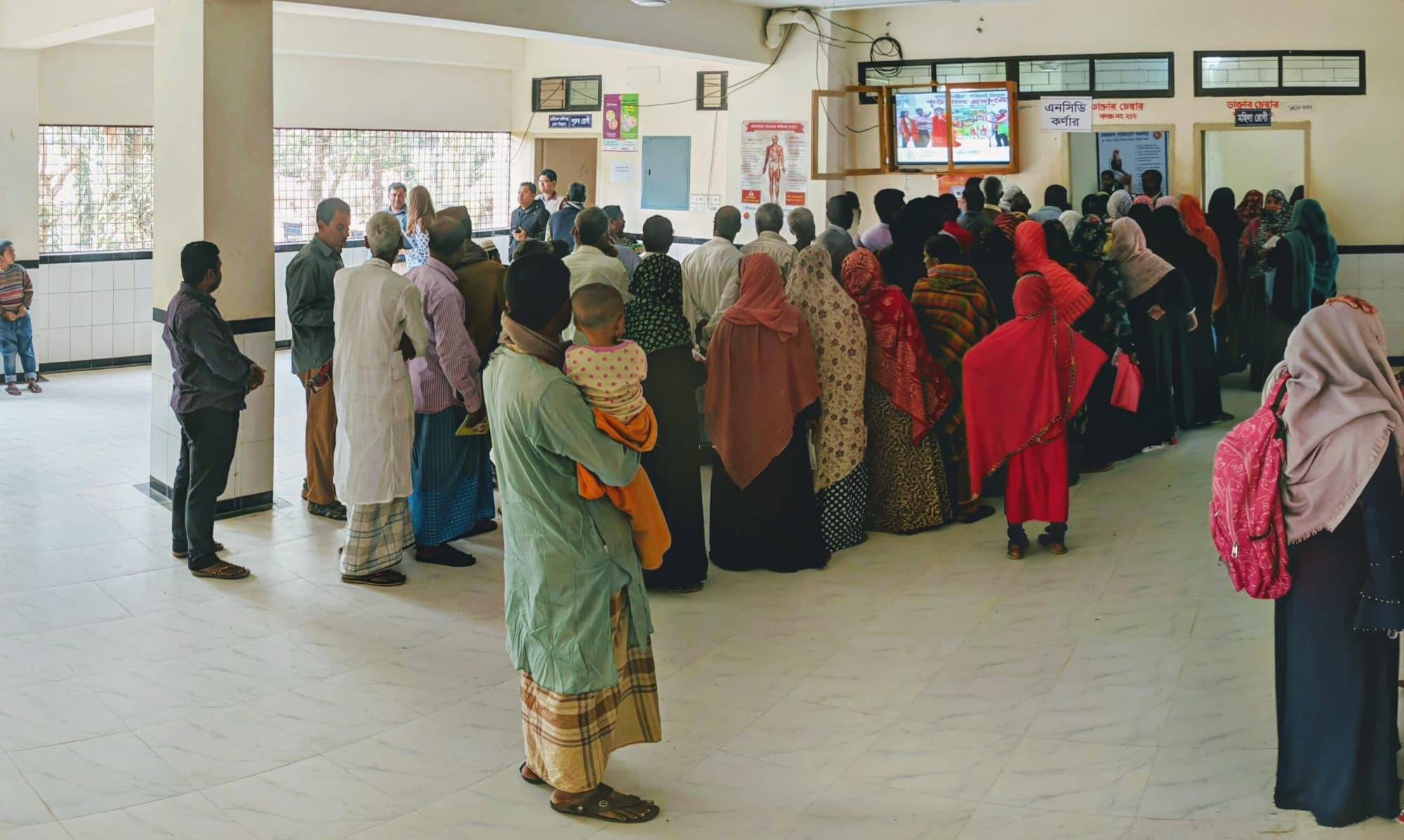 Patients queueing for blood pressure checks at the NCD corner of an Upazila Health Complex
