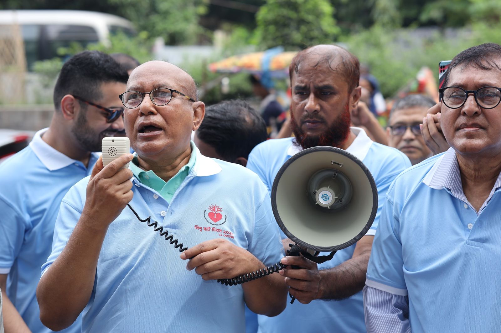 Leading the rally with a megaphone.