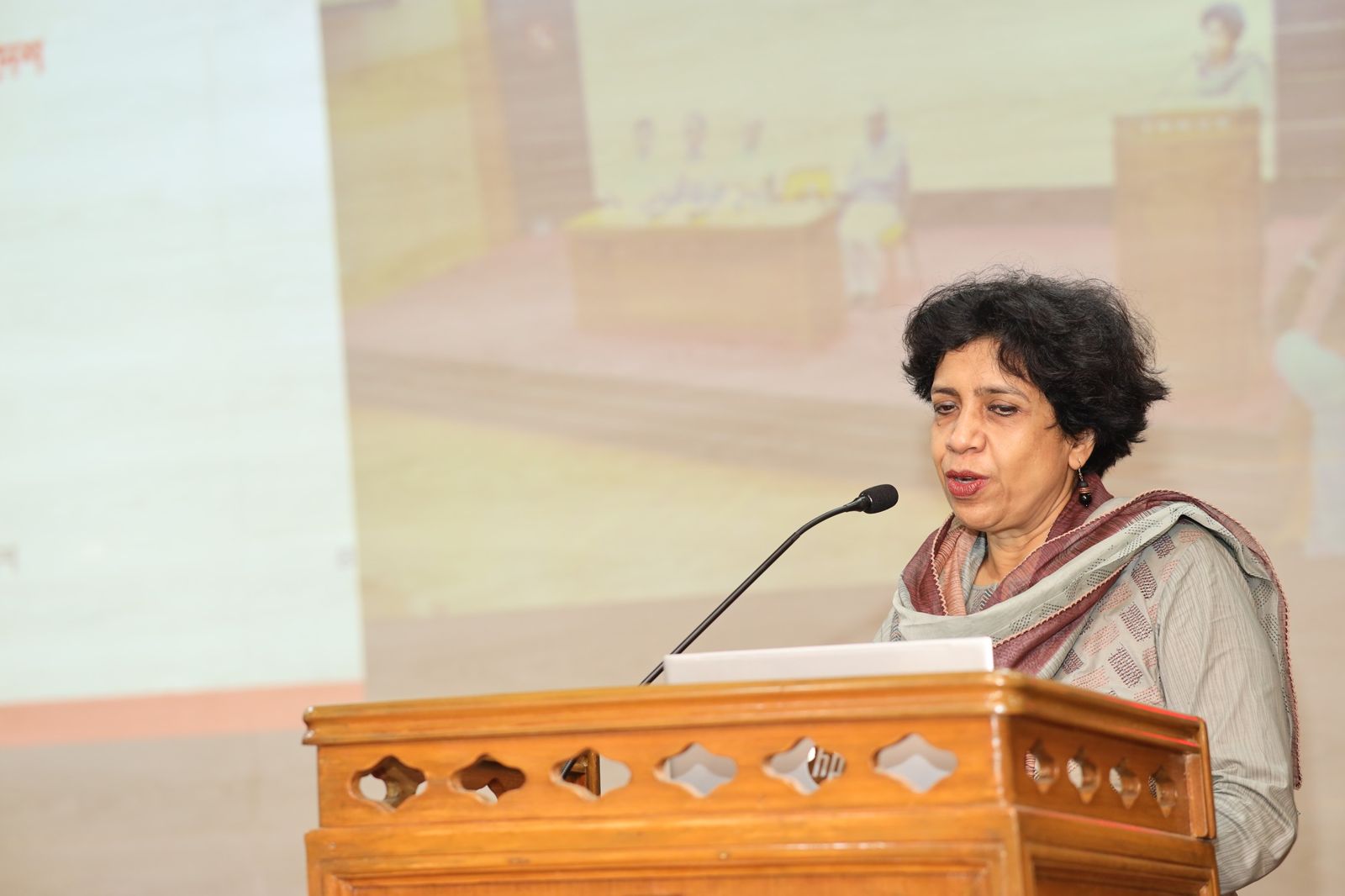 Addressing the audience.