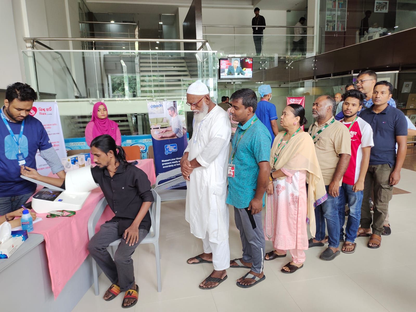 Staff queue for the free screening.