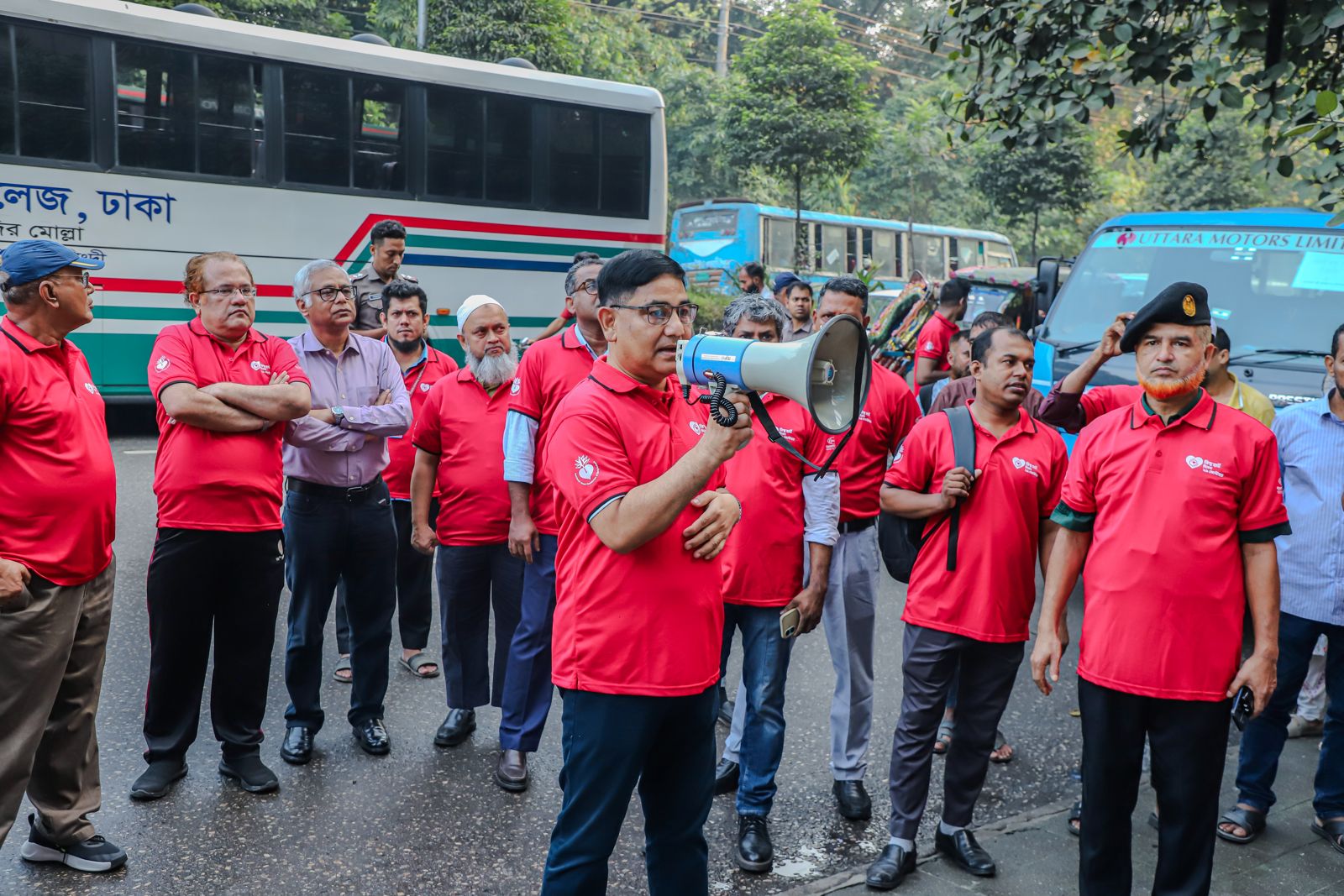Participants gather on the road outside the stadium.
